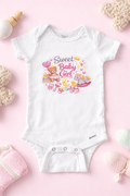 White baby onesie with 'Sweet Baby Girl' text and cartoon designs on a pink background.