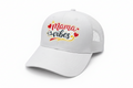 White cap with 'Mama Vibes' text on a white background
